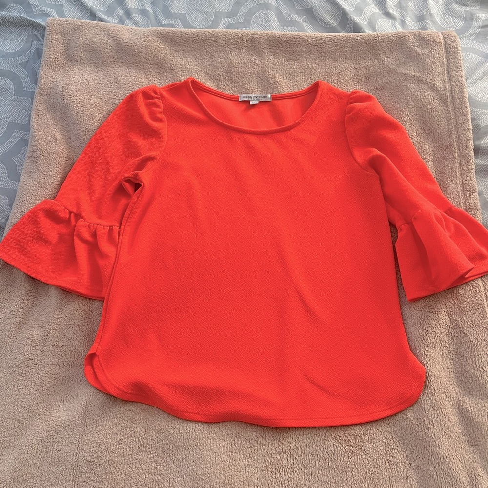 Green envelope orange top with ruffle sleeves
